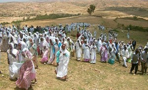 Arsma Dawit funeralWeeping women relatives and friends at Arsema's funeral, the Adiaklom mountain range in the background
