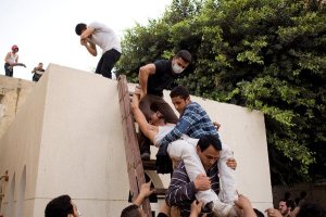 An injured man was helped outside the main Coptic Christian Cathedral in Cairo on Sunday. Coptic Christians make up about 10 percent of Egypt's population.
