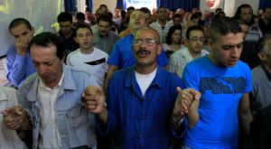 Protestant Berber men pray during a mass at a church in the Berber capital of Tizi Ouzou, 60 miles east of Algeria's capital Algiers, in 2010 (Reuters/Zohra Bensemra )
