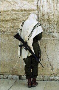 Israeli soldier with rifle praying at the Wailing Wall © Paul Chesley / National Geographic