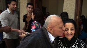 Iraqi Christians congratulate each other after Easter mass at Mar Youssif Chaldean Church in Baghdad on Sunday. (photo credit: AP Photo/ Karim Kadim)