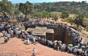 Out of stone: Bete Giyorgis, one of the 11 rock-hewn churches of Lalibela, Ehtiopia during the celebration of the Epiphany - the baptism of Jesus in the Jordan River.