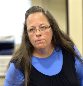 Rowan County Clerk Kim Davis listens to a customer following her office's refusal to issue marriage licenses at the Rowan County Courthouse in Morehead, Ky., Tuesday, Sept. 1, 2015. Although her appeal to the U.S. Supreme Court was denied, Davis still refuses to issue marriage licenses. (AP Photo/Timothy D. Easley)