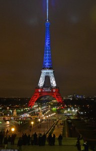 Stunning landmark: The iconic Eiffel Tower was lit up for the first time since the horrific attacks in Paris last Friday