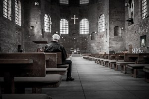 man sitting in church