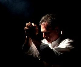 man kneeling in prayer