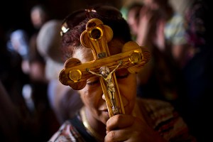 An Egyptian Coptic Christian pilgrim walks inside the Church of the Holy Sepulchre, traditionally believed by many to be the site of the crucifixion and burial of Jesus Christ, during Good Friday processions in Jerusalem's Old City. Christian followers of the Eastern Churches are marking the solemn period of Easter.